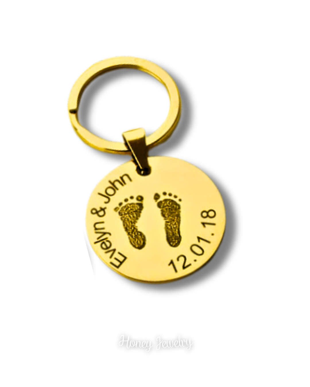Ronde sleutelhanger met babyvoetafdrukken