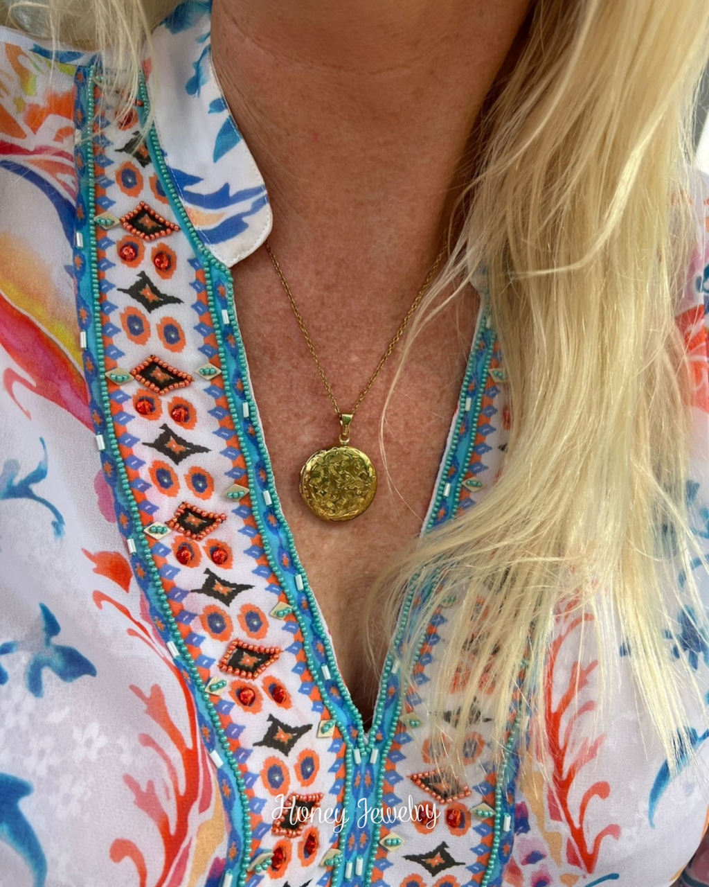 Ronde medaillonketting met bloemen